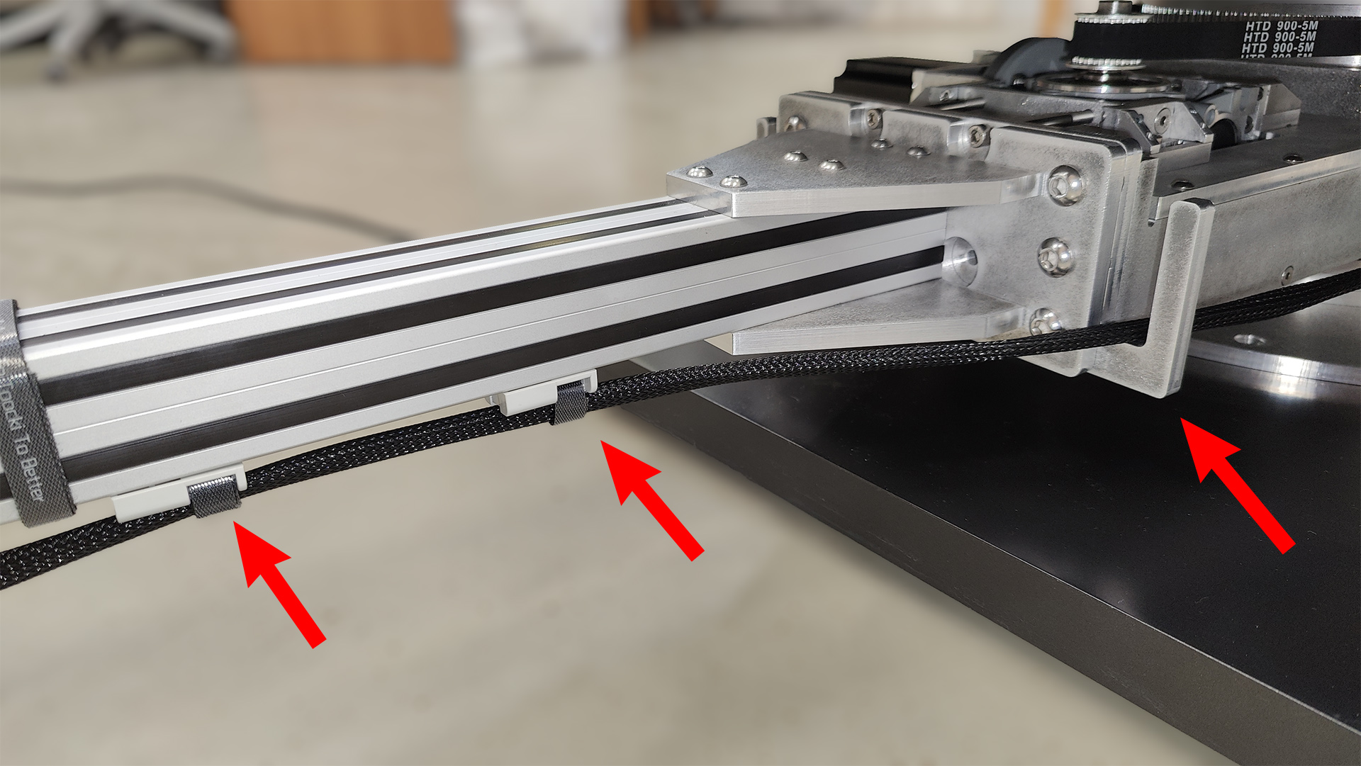 Securing the USB cables under the laptop stand beam